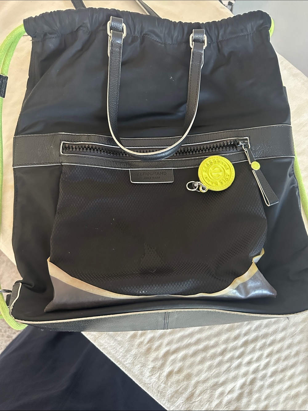 Cole Haan Zerogrand Convertible Nylon Backpack Tote in black with lime green